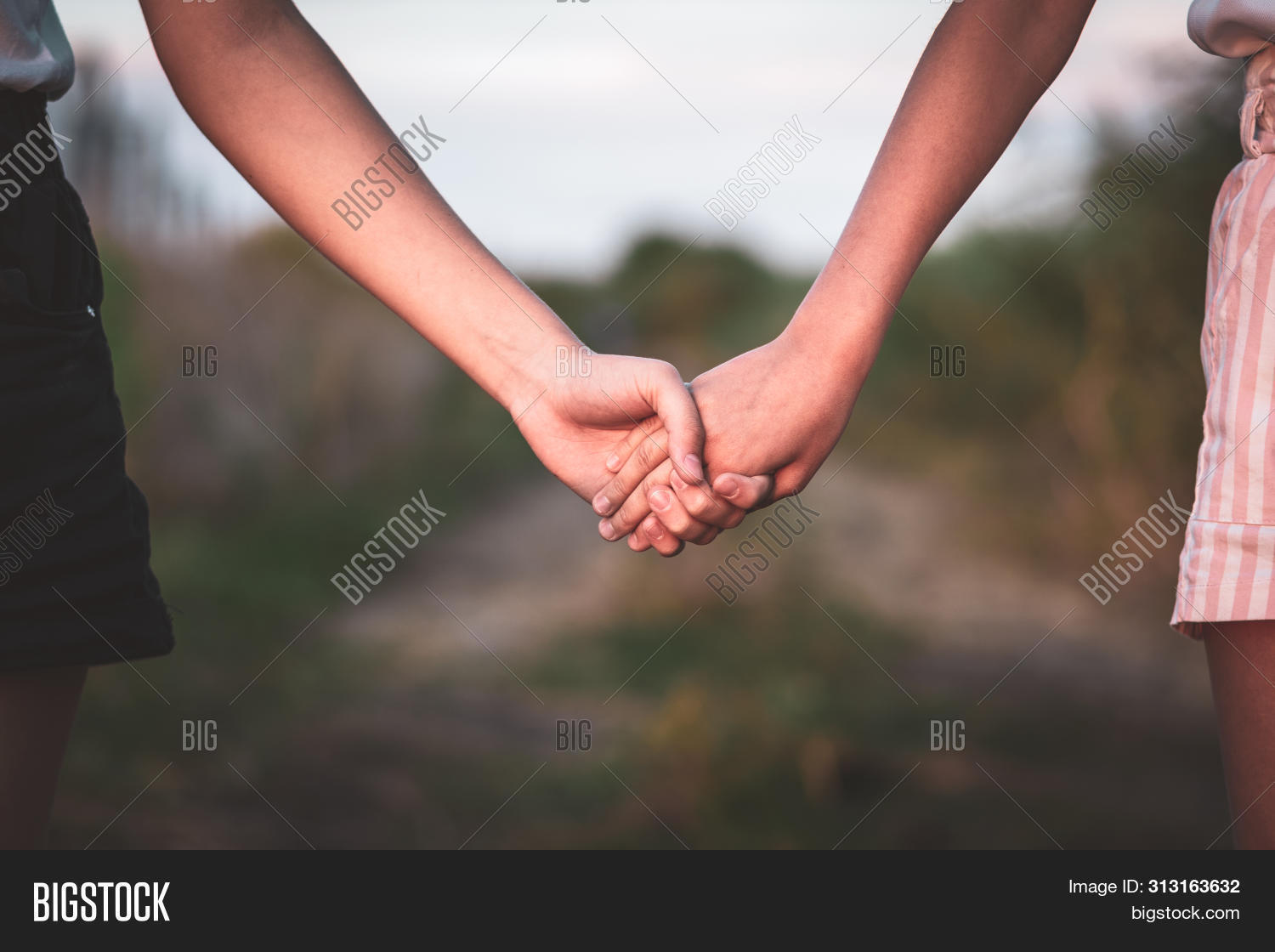 Girl And Guy Holding Hands - Holding Up To The Universe