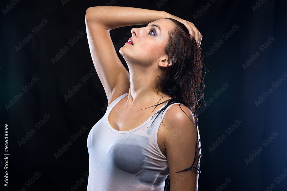 Wet woman in white t-shirt with black bra Stock Photo | Adobe Stock - Wet Van Behoud Van Energie